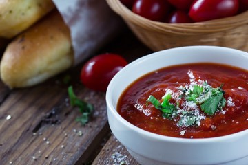 Fresh Marinara Pizza sauce in a bowl on wooden background