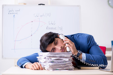 Busy businessman explaining business charts