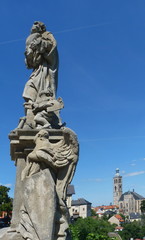 Fototapeta premium Statue on the bridge that connects Jesuit College and Saint Barbara church, Kutna Hora, Czech republic