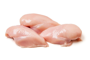 Raw chicken fillets close up on white