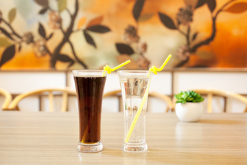 glass of orange juice on wooden table