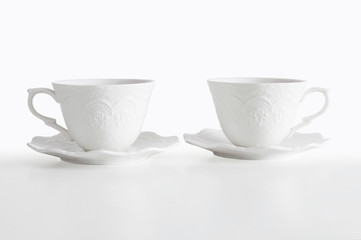 Two beautiful porcelain coffee cups on white background with clipping path, ready for mock up