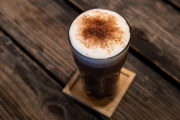 Chocolate smoothie, Cocoa drink, chocolate cocktail. On a wooden background.
