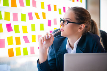 Beautiful female employee with many conflicting priorities 