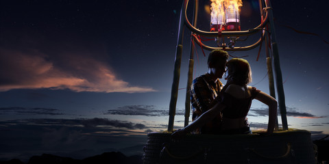 Young beautiful multiethnic couple kissing in the hot air balloon. Very romantic picrure night and...