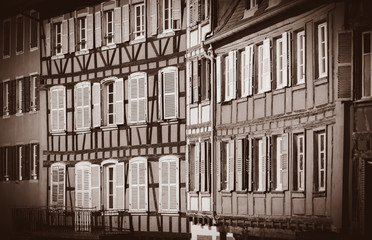 View at old houses with windows in autumn season. Strasburg, France