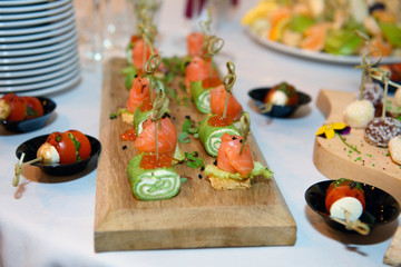 Canapes on the buffet table. A variety of food for parties.