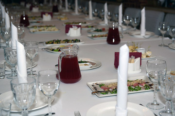 Festive table with food and drinks. A luxurious reception for guests.