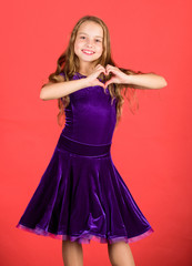 Fototapeta premium Love concept. Girl cute child show heart shaped hand gesture. Love and sympathy. Symbol of love. Kid adorable girl with long hair smiling face show heart gesture to you. Celebrate valentines day