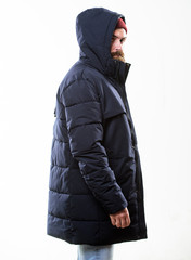 Hipster outfit. Hipster modern fashion. Guy wear hat and black winter jacket. Stylish and comfortable. Hipster style menswear. Man bearded hipster stand in warm black jacket parka isolated on white