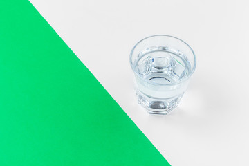 glasses of water on a color background