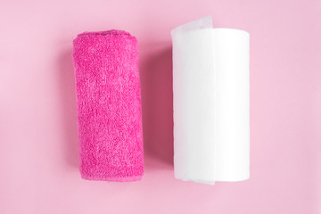 Cloth towel or paper towels on pink background. Skincare.