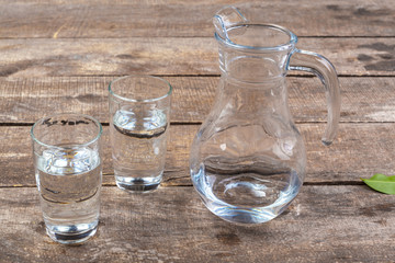 Glass of water on a wooden table
