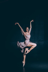 Ballerina dancing on one leg in pointe