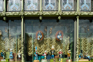 dolls in the window, sculptures, stained glass windows, modern architecture of the buildings of St. Petersburg