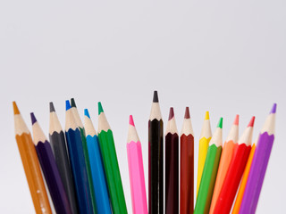 colored pencils sharpened on a white background.