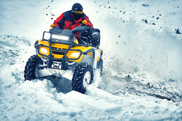 Winter walk on the quad bike in the forest. © 6okean
