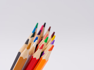 colored pencils sharpened on a white background.