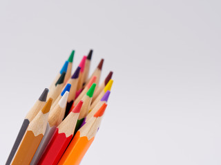 colored pencils sharpened on a white background.