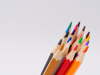 colored pencils sharpened on a white background.