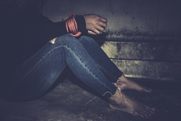Asian hostage woman Bound with rope at night scene,The thieves kidnapped for ransom,thailand people