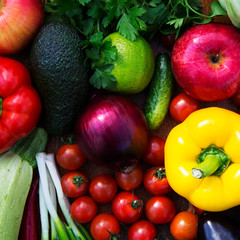 Assortment of different vegetables and fruits on wooden background. Top view. Closeup.