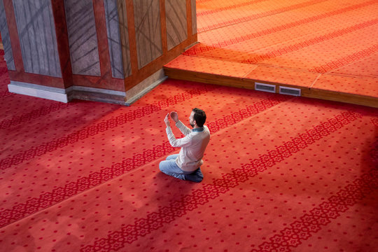 Muslim Man Praying Inside The Mosque. Top View