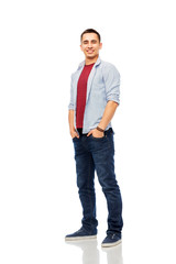 Naklejka premium people concept - smiling young man over white background