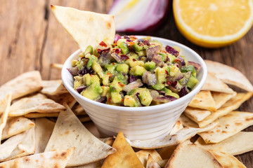 guacamole with corn chips closeup