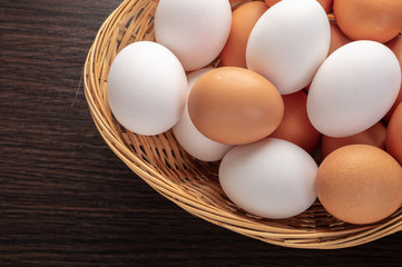 chicken eggs in a wicker bowl