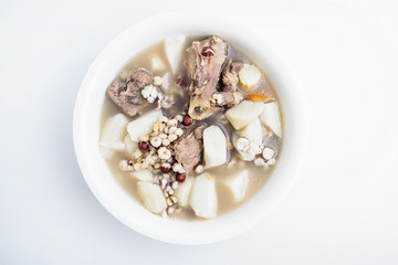Obraz na płótnie Canvas Yam glutinous rice glutinous pork bone soup / spleen health soup