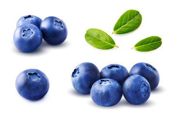 Blueberries set with leaves isolated on white background.