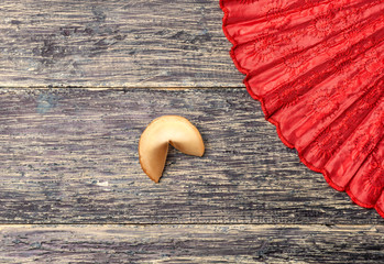 Fortune cookie and red fan