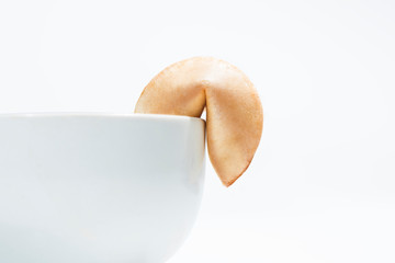 Fortune cookies on edge of the bowl for dessert dish
