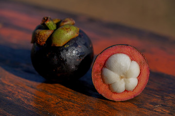 Mangosteen on wood background