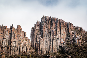 Naklejka premium cliffs of the tasman peninsula on tasmania island, amazing coastline the highest rock cliffs in australia and the southern hemisphere , spectacular boat cruise on the rough atlantic ocean