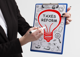 Business, technology, internet and networking concept. Young entrepreneur showing keyword: taxes...