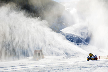 Professional Artificial Snow Machine Making Snowflakes at Ski Slope in Ski Resort Bansko in Bulgaria .Snowmaking Cannon