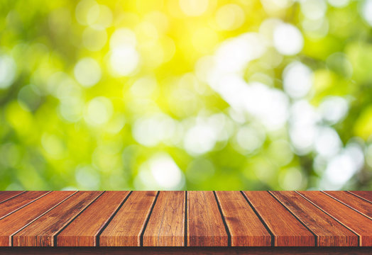Empty wood table top on green nature background, Template mock up for display of product