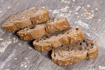 fresh slices of rye bread on wooden surface