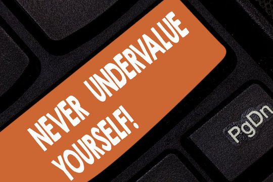 Handwriting text Never Undervalue Yourself. Concept meaning Certainly not underestimate your real worth Keyboard key Intention to create computer message pressing keypad idea