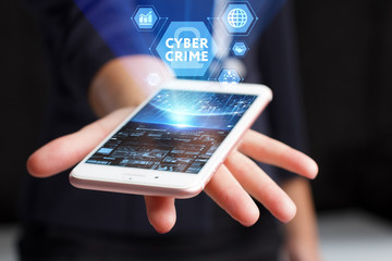 The concept of business, technology, the Internet and the network. A young entrepreneur working on a virtual screen of the future and sees the inscription: Cyber crime