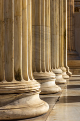 Classical marble pillars detail on the facade of a building