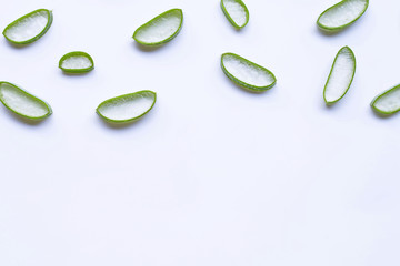 Aloe vera slices on white background.