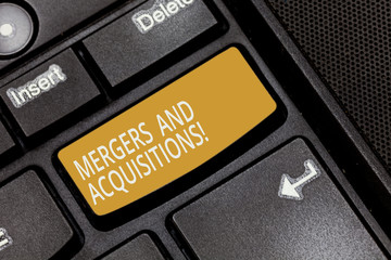 Writing note showing Mergers And Acquisitions. Business photo showcasing Refers to the...