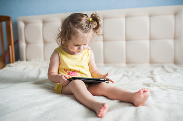 Happy child with tablet computer.