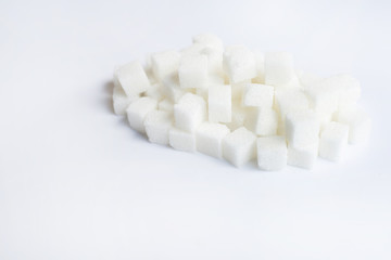Fototapeta na wymiar Sugar cubes on over white