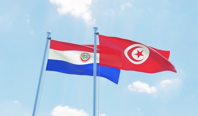 Tunisia and Paraguay, two flags waving against blue sky. 3d image
