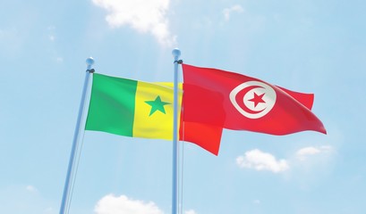 Tunisia and Senegal, two flags waving against blue sky. 3d image