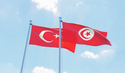 Tunisia and Turkey, two flags waving against blue sky. 3d image
